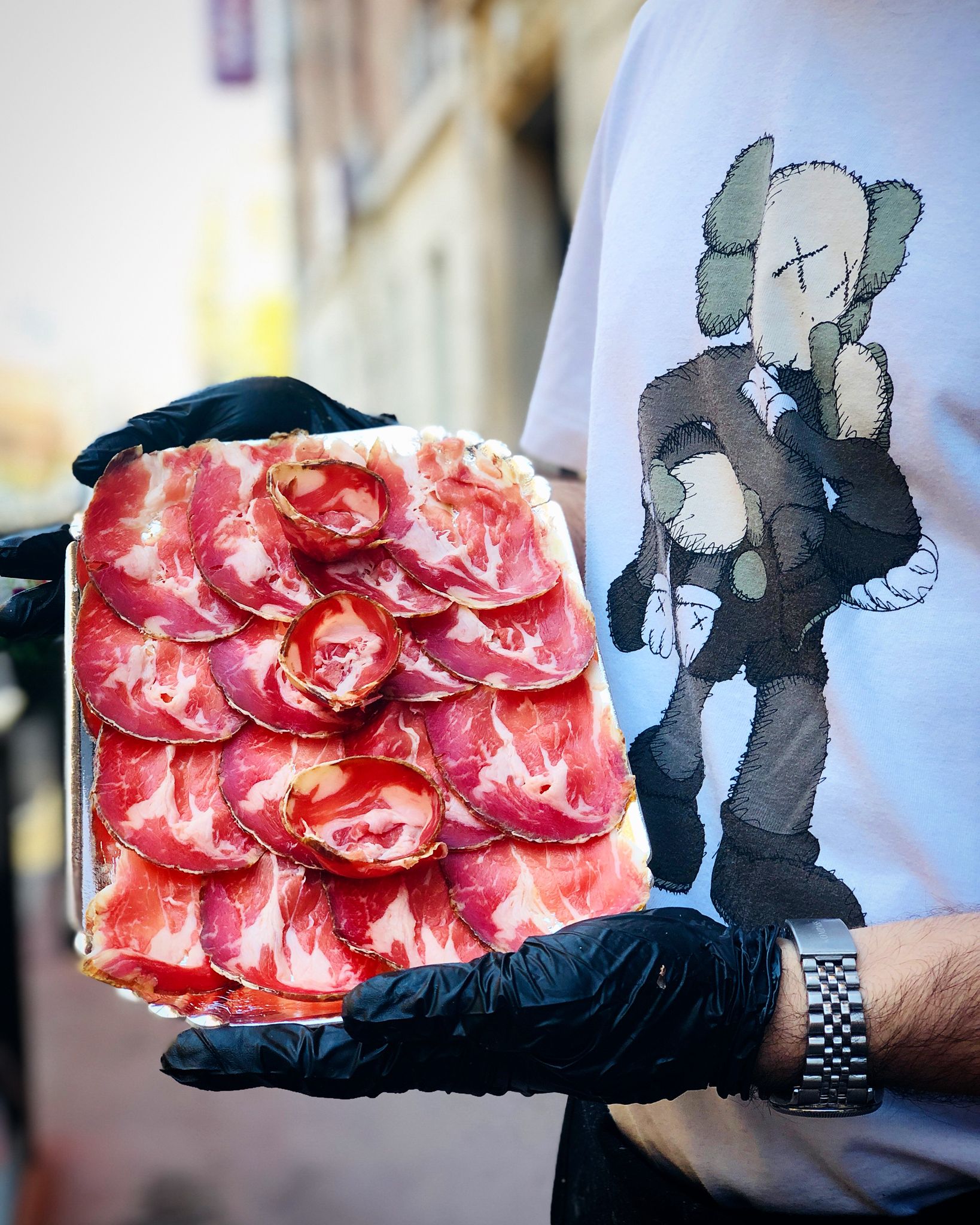 Bresaola platter held by chef
